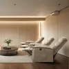 A modern living room with three recliners arranged in a row, facing a coffee table with a vase of flowers. Anteprima dell’immagine prodotto