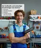A man in a workshop holding a pressure washer. Produktbild-Vorschau