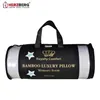 A rolled-up pillow in its branded packaging, presented against a white background. Produktbild-Vorschau