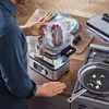 A person is using a sous vide cooker to prepare food in a kitchen setting. Produktbild-Vorschau