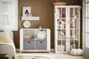 A child's bedroom with a white storage unit and a white cabinet. Podgląd zdjęcia produktu