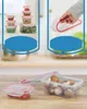 A collage of images showing food storage containers, with a close-up of containers filled with food and a hand demonstrating how to seal a container. Produktbild-Vorschau