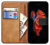 A brown leather wallet-style phone case with a credit card, euro banknotes, and a smartphone displaying a betta fish wallpaper. Podgląd zdjęcia produktu