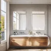 A modern bathroom with a double vanity, mirrors, and a large window. Produktbild-Vorschau