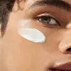 A close-up of a person's face with sunscreen applied to their cheek. Produktbild-Vorschau