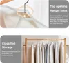 Close-up of a garment bag on a hanger and a rack of garment bags. Produktbild-Vorschau