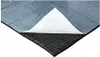 A piece of sound insulation material with a white protective layer peeled back. Produktbild-Vorschau