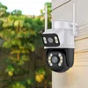 A security camera mounted on a wooden wall, with greenery in the background. Produktbild-Vorschau