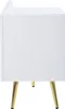 A side view of a white cabinet with gold legs. Anteprima dell’immagine prodotto