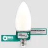 A single LED candle bulb is shown against a light gray background. It has several marketing labels attached to its base. Náhled obrázku produktu