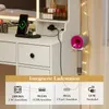 A close-up view of a vanity table with integrated charging station and a hairdryer holder. Podgląd zdjęcia produktu