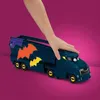 A child's hand is shown interacting with a toy Batmobile transporter. Anteprima dell’immagine prodotto