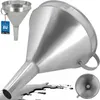 A metal funnel is shown with a smaller funnel and a spill of liquid in the foreground. Produktbild-Vorschau
