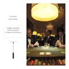 Three men in formal wear playing poker at a table in a dimly lit, opulent room. Produktbild-Vorschau