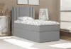 A single bed with a grey upholstered base and headboard, dressed with a white and grey patterned duvet and pillow, set in a neutral-toned room. Produktbild-Vorschau