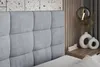 A bedroom scene with a bed, nightstand, and decor. Produktbild-Vorschau