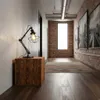 A modern hallway with industrial-style decor, featuring a wooden cube side table with a black metal desk lamp. Náhled obrázku produktu