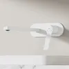 A white wall-mounted faucet with a lever handle is shown against a plain background, with a marble countertop visible below. Podgląd zdjęcia produktu