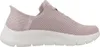 A side view of a pink Skechers slip-on sneaker with a white sole. Anteprima dell’immagine prodotto