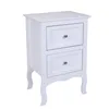 A white bedside table with two drawers and silver knobs, shown against a white background. Produktbild-Vorschau