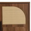 Close-up of a wooden cabinet door with a rattan insert and fluted wood detail. Anteprima dell’immagine prodotto