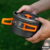 Hands holding a camping cooking pot outdoors. Náhled obrázku produktu