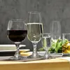 A collection of wine glasses filled with different beverages, set on a table. Podgląd zdjęcia produktu