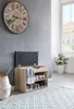 A hallway or entryway scene featuring a shoe bench with storage, a basket, and a large wall clock. Náhľad obrázku produktu