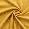 A close-up view of crumpled yellow muslin fabric. Voir les images du produit