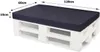 A dark blue cushion on top of a white wooden pallet, with dimensions indicated. Produktbild-Vorschau