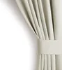 A close-up view of a cream-colored curtain with a tie-back. Podgląd zdjęcia produktu