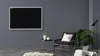 A modern living room with a wall-mounted magnetic chalkboard, a chair, a side table, and a plant. Produktbild-Vorschau