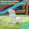 A white Adirondack chair for children is placed on a green lawn in front of a playground slide. Produktbild-Vorschau