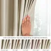 A hand is shown parting a beige curtain, with a series of smaller images below demonstrating how the color perception of the curtain changes under different lighting conditions. Produktbild-Vorschau