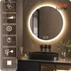 A modern bathroom with a round LED mirror above a black sink. Náhled obrázku produktu