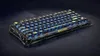 A mechanical keyboard with RGB lighting on a dark, textured surface. Produktbild-Vorschau