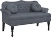 A dark gray velvet bench with tufted back and two round throw pillows, shown from the front on a white background. Náhled obrázku produktu