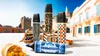 A collection of designer highlighters arranged in an outdoor setting with buildings and a basket of fruit. Voir les images du produit