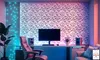 A modern gaming or home office setup with a desk, computer, chair, and decorative wall panels. Produktbild-Vorschau