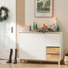 A hallway or entryway with a white door, a sideboard, and decorative items. Produktbild-Vorschau