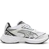 A studio shot of a single Puma sneaker against a white background. Voir les images du produit