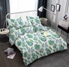 A bed with green fern-patterned bedding in a bedroom setting. Produktbild-Vorschau