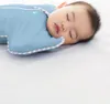 A baby sleeping in a blue swaddle. Anteprima dell’immagine prodotto