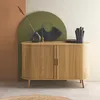 A wooden sideboard with decorative items on top, set against a backdrop of colored arches. Anteprima dell’immagine prodotto