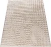 A close-up, angled view of a beige rug with a textured, bubbly pattern. Produktbild-Vorschau