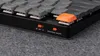 A close-up shot of a mechanical keyboard, focusing on the side panel with switches and labels. Produktbild-Vorschau