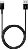 A black USB-C to USB-A charging cable coiled in the center, with the USB-C connector on the left and the USB-A connector on the right. Produktbild-Vorschau