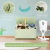 A child's toy chest with stuffed animals inside, displayed in a room with wall decorations. Voir les images du produit