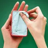 Hands holding a red container with light blue product inside, with one hand scooping out the product. Náhľad obrázku produktu