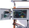 A close-up view of the internal electrical components of a machine, including circuit boards, wires, and capacitors. Anteprima dell’immagine prodotto